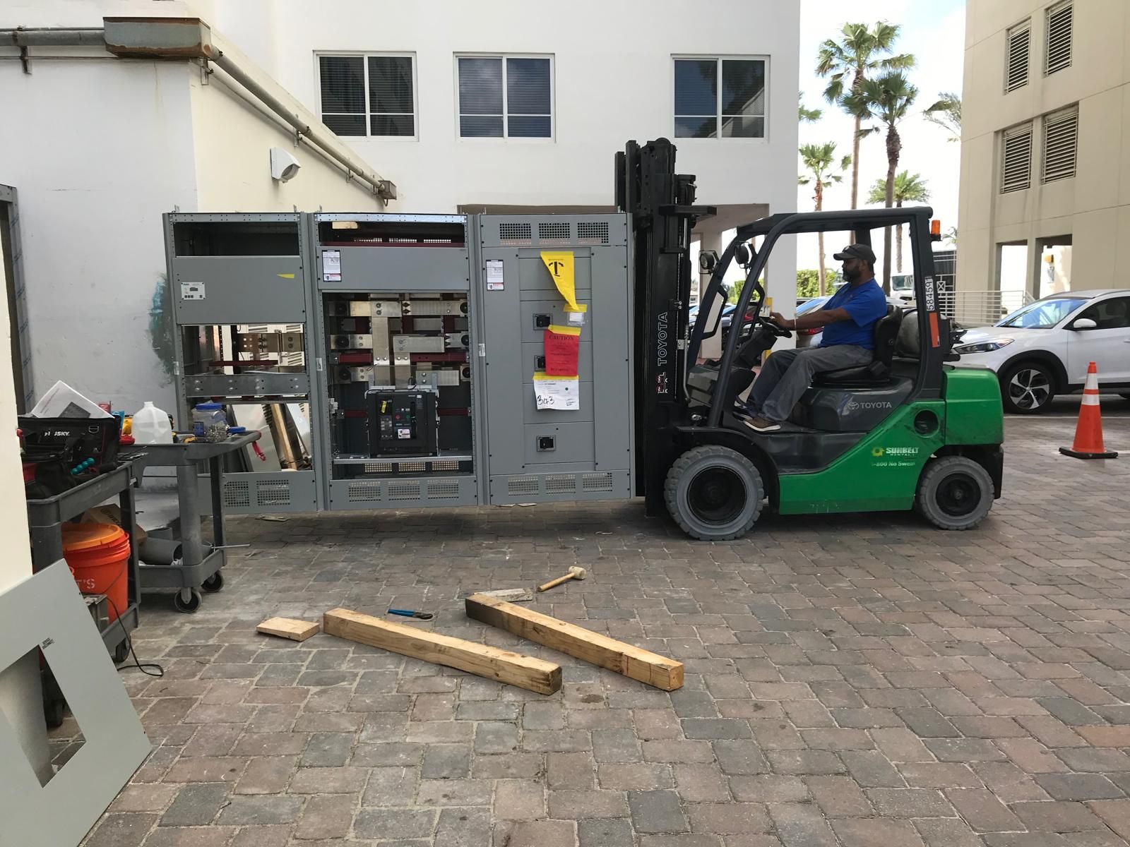 Forklift moving switch gear into place